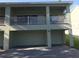 Two-story duplex with private balconies and garages at 124 Orange Ave, Clermont, FL 34711