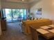 Spacious living room with large windows and comfortable seating at 124 Orange Ave, Clermont, FL 34711