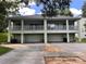 Two-story duplex with two-car garages and balconies at 124 Orange Ave, Clermont, FL 34711