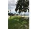 Community playground with playset near a waterfront at 124 Orange Ave, Clermont, FL 34711