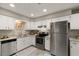 Modern kitchen featuring stainless steel appliances and granite countertops at 24 Cove Ln, Eustis, FL 32726