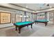 Community billiards room with two pool tables at 8469 Norwich Way, Mount Dora, FL 32757