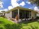 Outdoor screened patio with lush landscaping at 4706 Glen Coe St, Leesburg, FL 34748