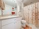 Clean bathroom with a shower/tub combo and seashell decor at 4706 Glen Coe St, Leesburg, FL 34748