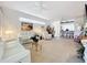 Spacious living room featuring a large TV and comfortable seating at 4706 Glen Coe St, Leesburg, FL 34748
