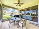 Relaxing screened porch with glass sliders and outdoor seating at 4706 Glen Coe St, Leesburg, FL 34748