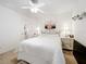 Bright bedroom with a queen-size bed and a large mirror at 4706 Glen Coe St, Leesburg, FL 34748
