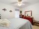 Charming bedroom with a queen-size bed and wooden furniture at 4706 Glen Coe St, Leesburg, FL 34748