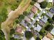 Aerial view showing homes and a street layout in a residential community at 4706 Glen Coe St, Leesburg, FL 34748