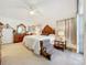 Spacious primary bedroom with king-size bed, dresser and additional storage at 4706 Glen Coe St, Leesburg, FL 34748