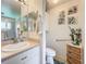 Bathroom with single vanity, toilet and walk-in shower at 4706 Glen Coe St, Leesburg, FL 34748