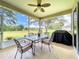 Spacious screened porch with seating area and golf course views at 4706 Glen Coe St, Leesburg, FL 34748