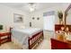 Serene bedroom with a queen-size bed and lovely artwork at 4706 Glen Coe St, Leesburg, FL 34748