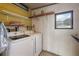 Laundry room with washer, dryer, and shelving at 1605 W Schwartz Blvd, The Villages, FL 32159