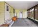 Enclosed porch with neutral carpeting and storage at 1605 W Schwartz Blvd, The Villages, FL 32159