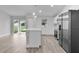 Open concept kitchen with island and stainless steel appliances at 5 Malauka Radial Run Rd, Ocklawaha, FL 32179