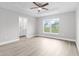 Spacious bedroom with ensuite bathroom access and vinyl flooring at 5 Malauka Radial Run Rd, Ocklawaha, FL 32179