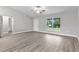 Spacious living room with vinyl flooring and an entryway at 5 Malauka Radial Run Rd, Ocklawaha, FL 32179