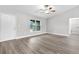 Spacious living room with vinyl flooring and an entryway at 5 Malauka Radial Run Rd, Ocklawaha, FL 32179