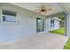 Covered patio with ceiling fan and sliding glass door at 5 Malauka Radial Run Rd, Ocklawaha, FL 32179