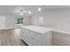 Open concept kitchen with island and stainless steel appliances at 5 Malauka Radial Run Rd, Ocklawaha, FL 32179