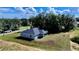 Aerial view of house from backyard, showing new landscaping at 5 Malauka Radial Run Rd, Ocklawaha, FL 32179