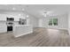 Modern kitchen featuring white cabinets, stainless steel appliances, and an island at 5 Malauka Radial Run Rd, Ocklawaha, FL 32179