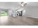 Open concept living room and kitchen with vinyl flooring at 5 Malauka Radial Run Rd, Ocklawaha, FL 32179