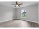 Bright bedroom with ceiling fan and vinyl plank flooring at 5 Malauka Radial Run Rd, Ocklawaha, FL 32179