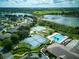 Aerial view of community pool, tennis courts, and clubhouse at 21945 King Henry Ave, Leesburg, FL 34748