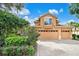 Home exterior with paver driveway and lush landscaping at 5008 Greenbriar Trl, Mount Dora, FL 32757