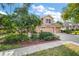 Two story home with attached two car garage, lush landscaping at 5008 Greenbriar Trl, Mount Dora, FL 32757