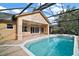 Relaxing pool area with covered patio and jacuzzi at 5008 Greenbriar Trl, Mount Dora, FL 32757