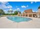 Community swimming pool and pool house with adjacent golf course at 5008 Greenbriar Trl, Mount Dora, FL 32757