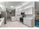 Well-equipped kitchen with stainless steel appliances and white cabinets at 9823 Se 178Th Ln, Summerfield, FL 34491