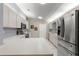 Bright kitchen features stainless steel appliances and ample counter space at 9823 Se 178Th Ln, Summerfield, FL 34491