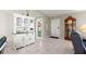 Inviting entryway with a white hutch and grandfather clock at 9823 Se 178Th Ln, Summerfield, FL 34491