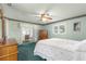 Serene bedroom with a queen-size bed and access to a patio at 9823 Se 178Th Ln, Summerfield, FL 34491