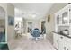 Charming dining area with a glass table and four chairs at 9823 Se 178Th Ln, Summerfield, FL 34491