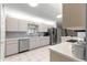 Clean kitchen with stainless steel dishwasher and ample counter space at 9823 Se 178Th Ln, Summerfield, FL 34491