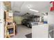 Garage with washer, dryer, workbench, and car at 9823 Se 178Th Ln, Summerfield, FL 34491
