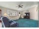 Bright living room with plush seating and a large TV at 9823 Se 178Th Ln, Summerfield, FL 34491