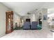 Spacious living room with two comfy armchairs and a large TV at 9823 Se 178Th Ln, Summerfield, FL 34491