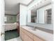 Bathroom with a vanity and sink, adjacent to a bedroom at 9823 Se 178Th Ln, Summerfield, FL 34491