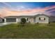 Single-story house with white siding and carport at 9823 Se 178Th Ln, Summerfield, FL 34491