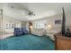 Relaxing living room with comfortable seating and a large TV at 9823 Se 178Th Ln, Summerfield, FL 34491