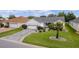 One-story house with a paved driveway and landscaped yard at 17913 Se 88Th Cascade Ct, The Villages, FL 32162