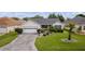 One-story house with a paved driveway and landscaped yard at 17913 Se 88Th Cascade Ct, The Villages, FL 32162