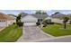 One-story house with a paved driveway and landscaped yard at 17913 Se 88Th Cascade Ct, The Villages, FL 32162