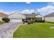 One-story house with a paved driveway and landscaped yard at 17913 Se 88Th Cascade Ct, The Villages, FL 32162